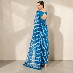 Zarfina blue digital printed chiffon saree with a raw silk blouse featuring a back cutout and tie detail