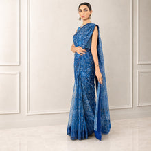 Zarfina blue digital printed chiffon saree with raw silk blouse, worn by a model in a formal setting.