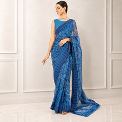 Zarfina blue digital printed chiffon saree with a matching raw silk blouse worn by a model in a formal setting.