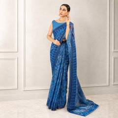 Zarfina blue digital printed chiffon saree with raw silk blouse worn by a model in a formal setting.