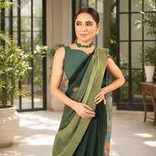 Zarfina digital printed chiffon saree set with a sleeveless raw silk blouse in dark green for formal occasions.